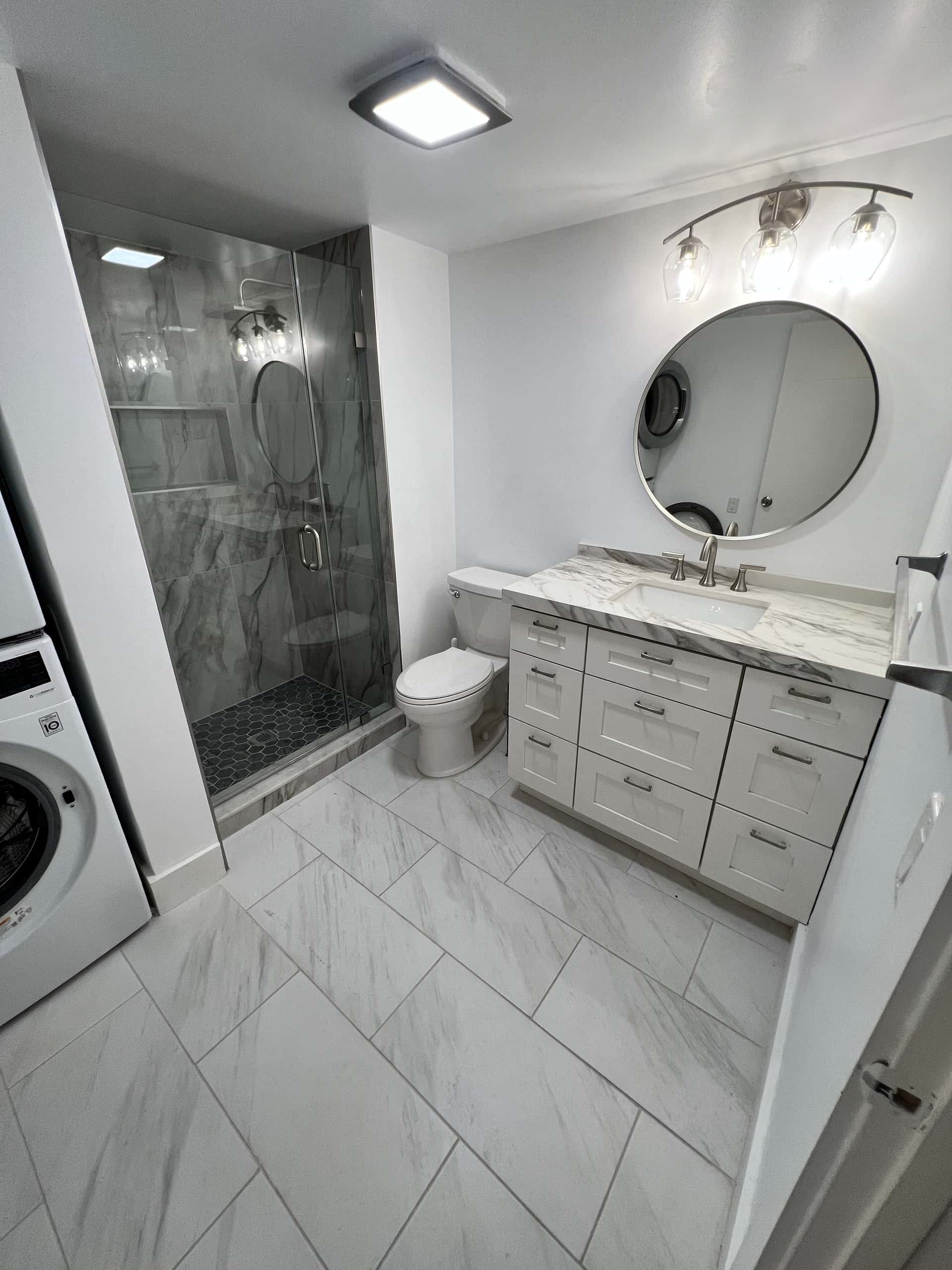 Elegant Bathroom with Double Vanity and Marble Finishes