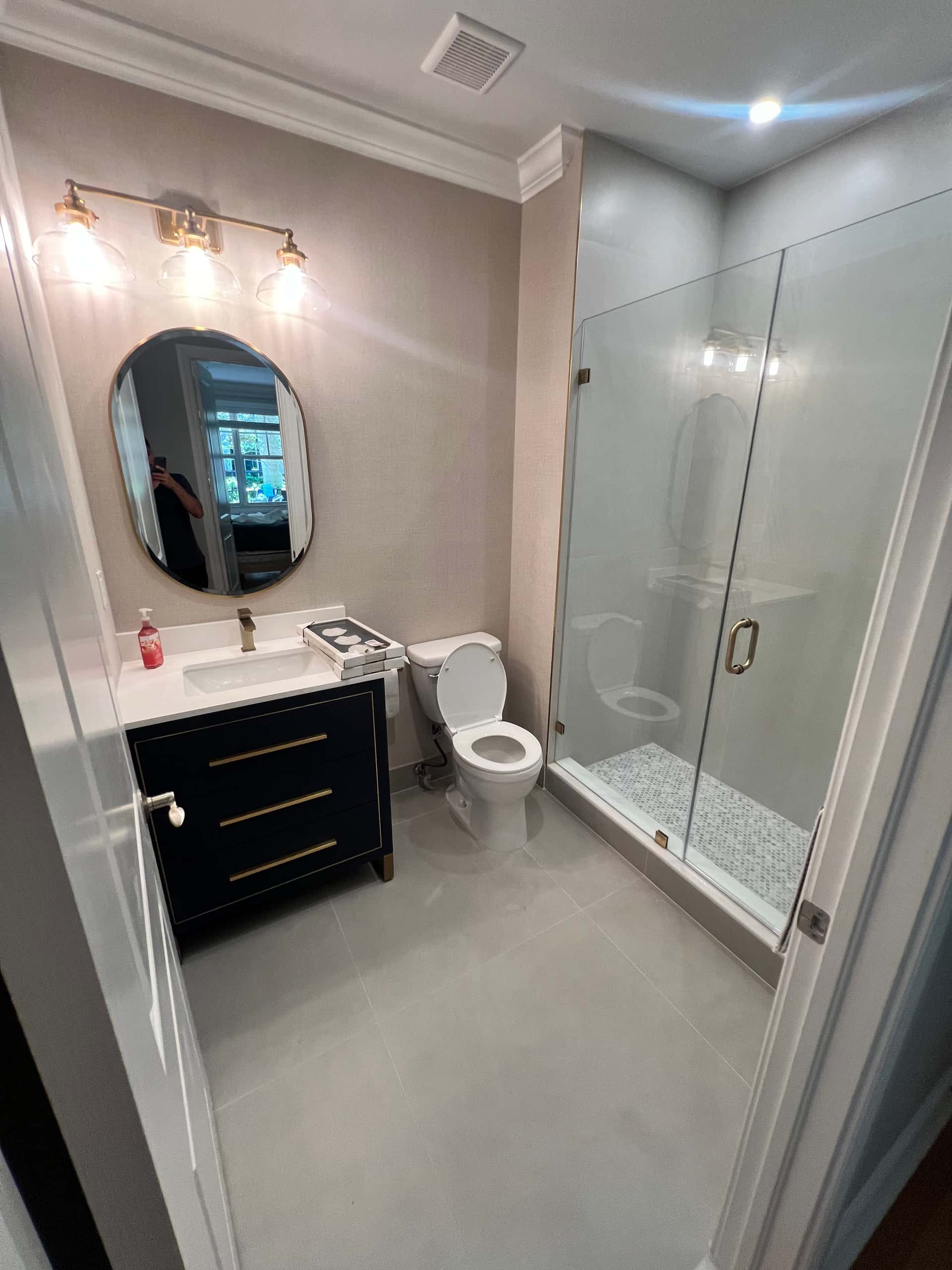 Stylish Bathroom with Black Vanity and Glass Shower