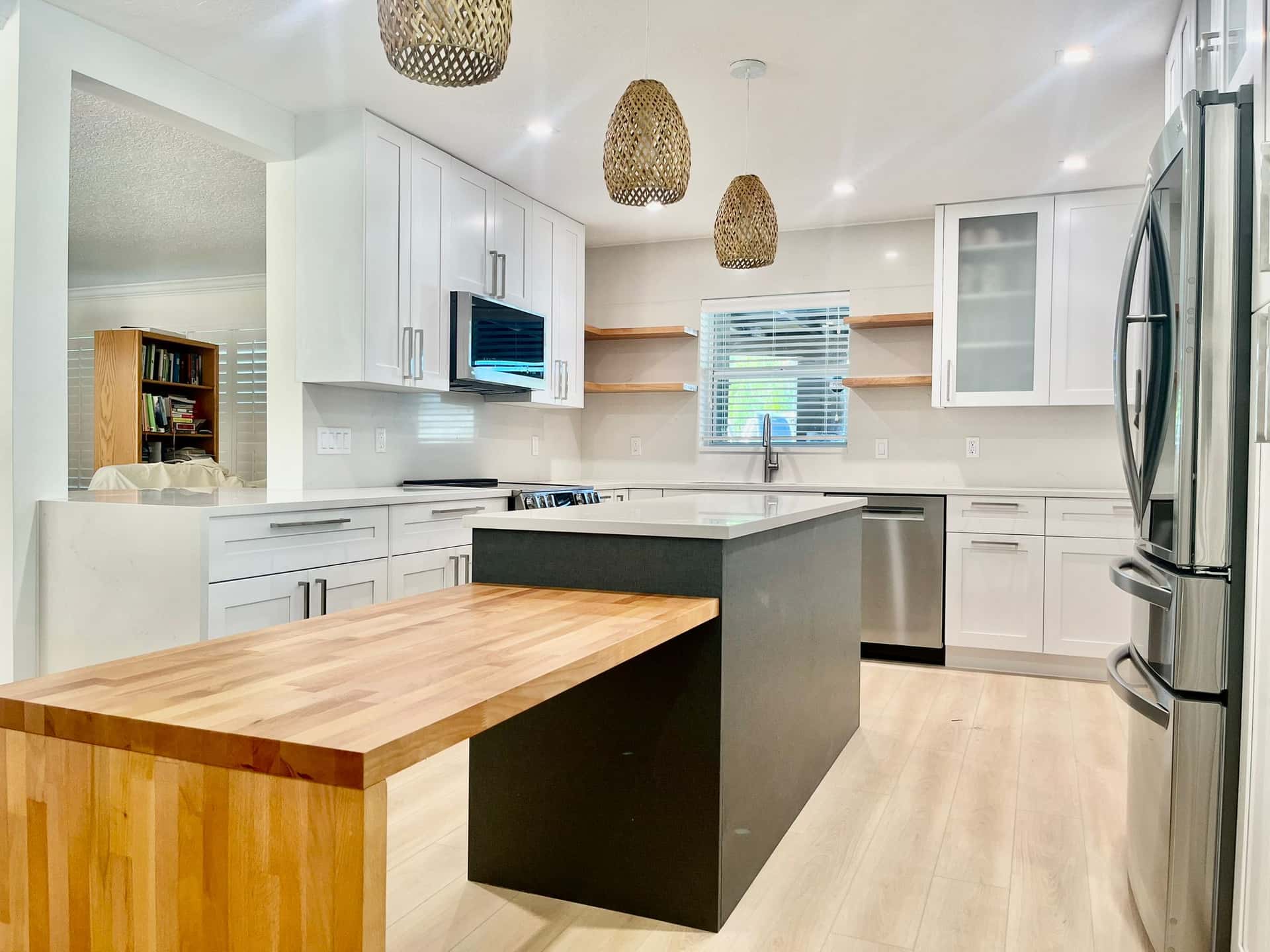 Contemporary Kitchen with White Cabinets and Wood Island