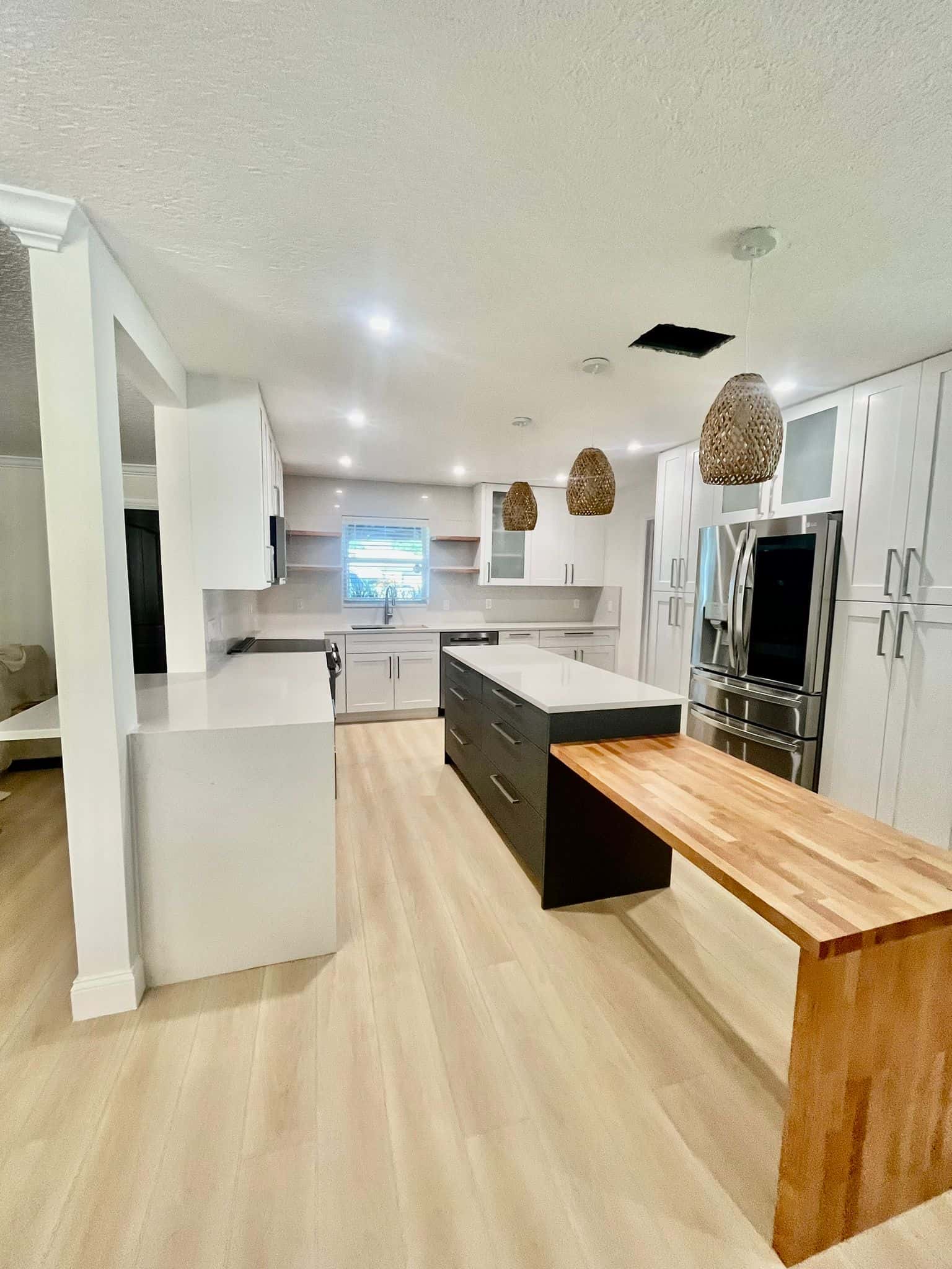Open Concept Kitchen with Modern Appliances and Wood Flooring